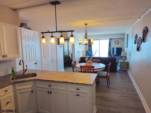 a kitchen with a table and chairs in it