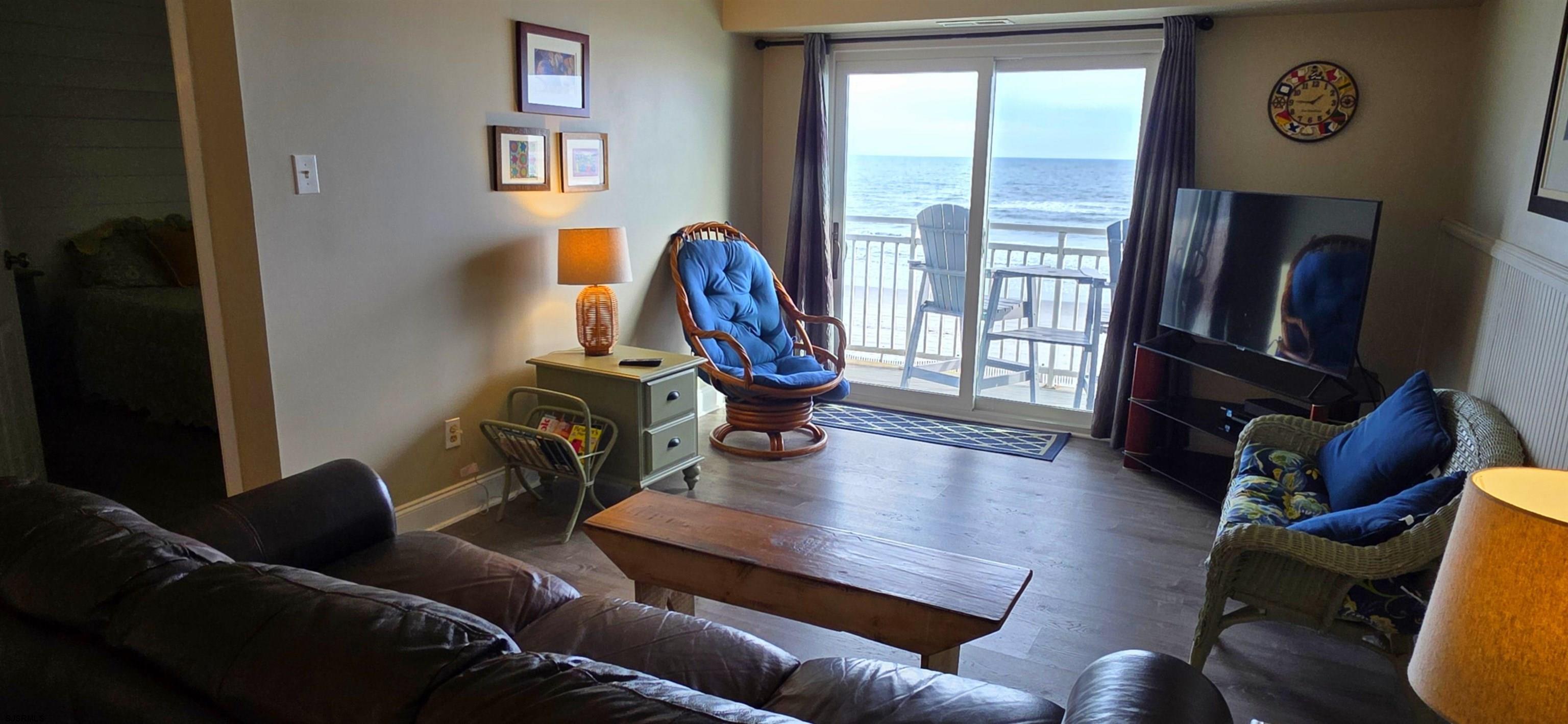 700 East Brigantine Avenue, Unit 2D Brigantine, NJ 08203 - Photo 6 of 21 a living room with furniture a rug and a window