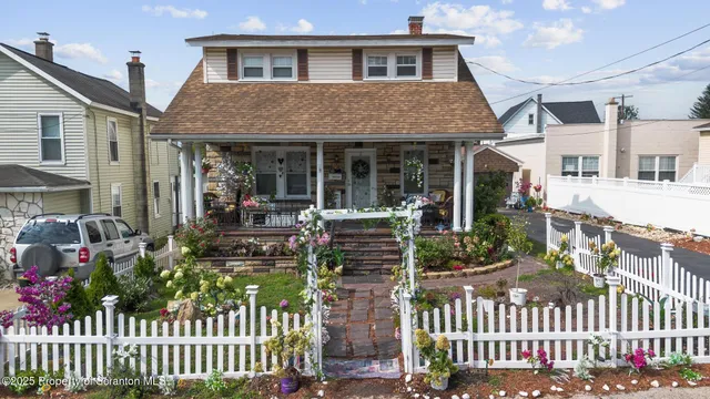 a front view of a house with a porch