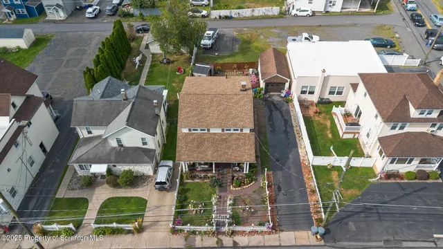 an aerial view of houses with outdoor space