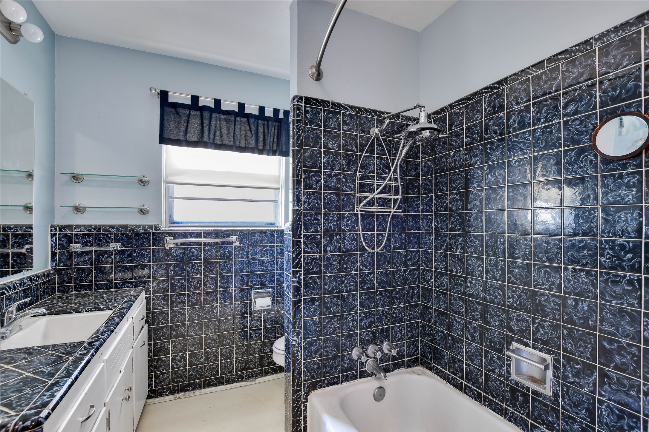 3317 Bosque Lane Austin, TX 78754 - Photo 13 of 18 a bathroom with a granite countertop sink a toilet and bathtub