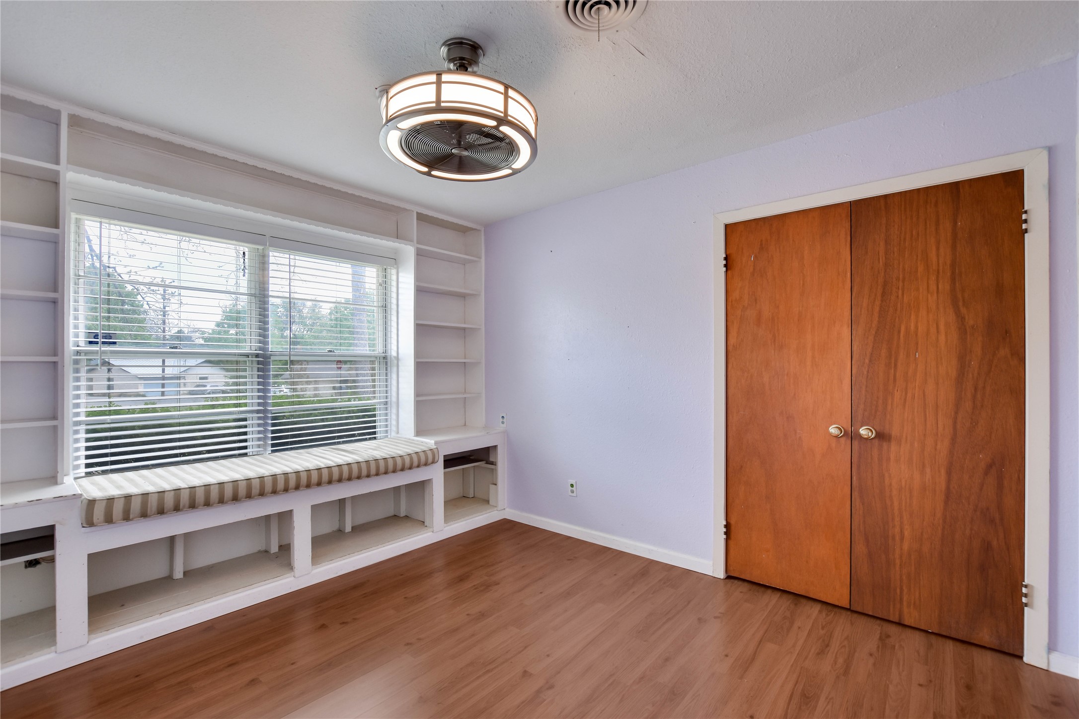 3317 Bosque Lane Austin, TX 78754 - Photo 15 of 18 a view of empty room with wooden floor and fan