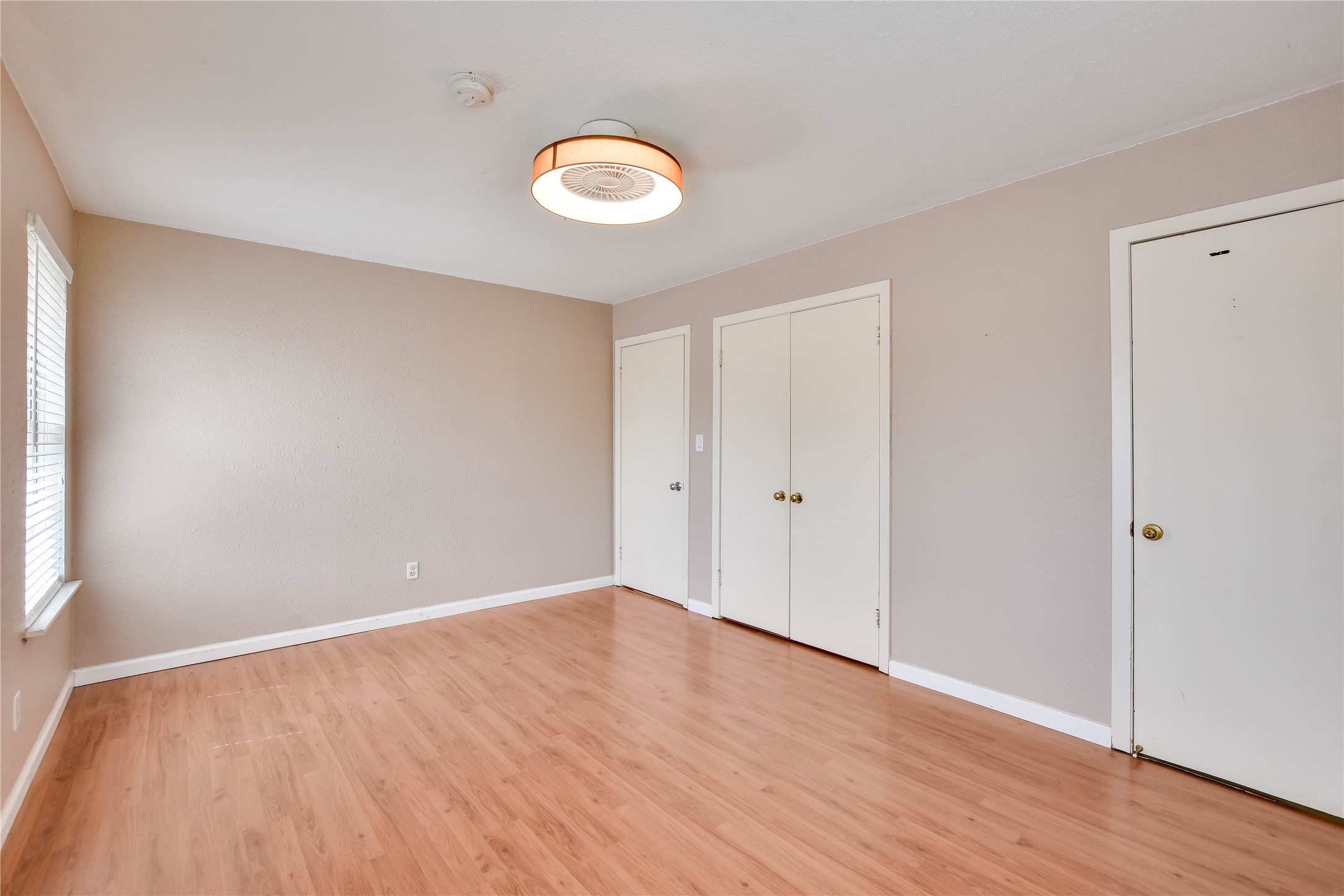 3317 Bosque Lane Austin, TX 78754 - Photo 17 of 18 a view of an empty room with wooden floor