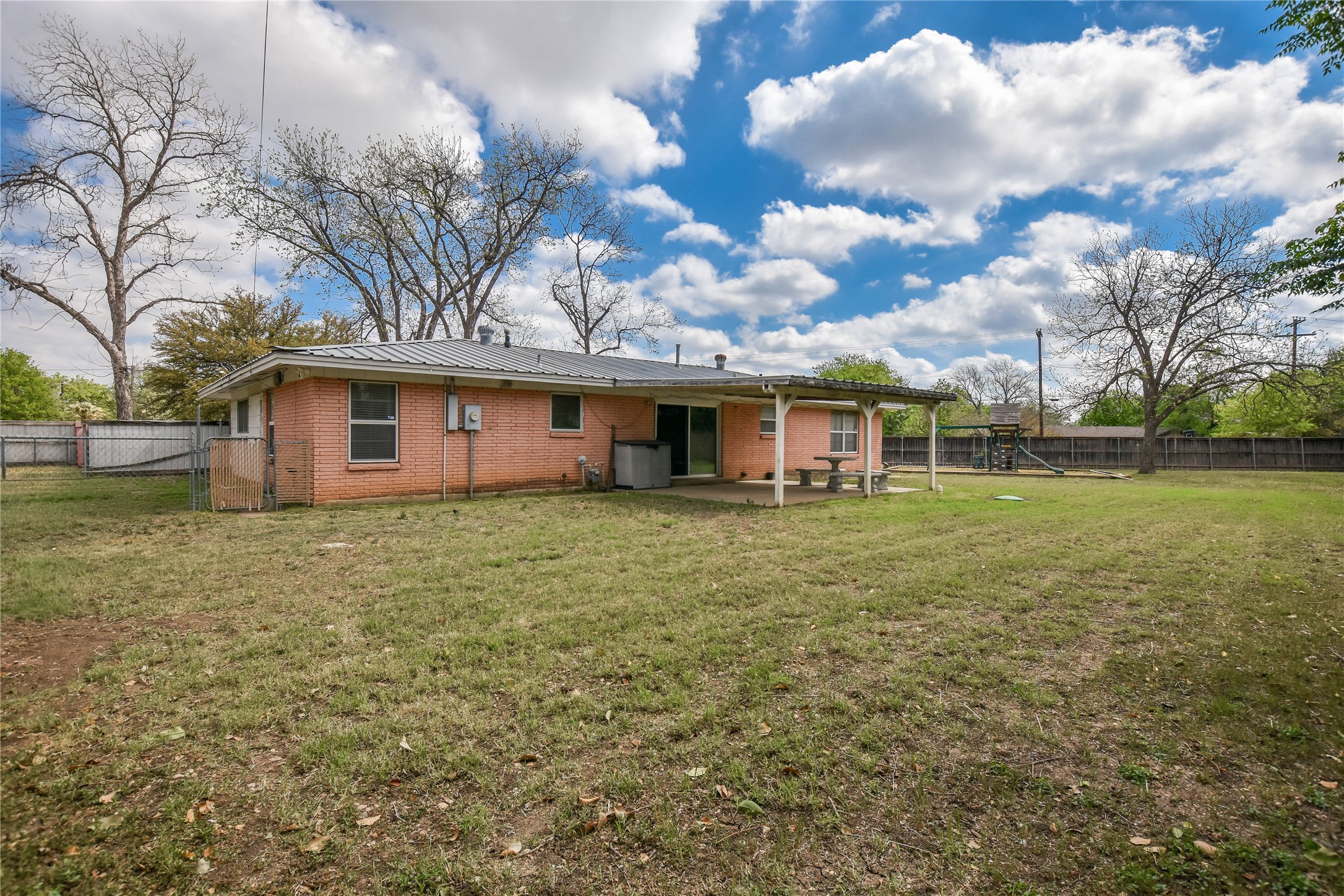 3317 Bosque Lane Austin, TX 78754 - Photo 8 of 18 a front view of a house with a garden