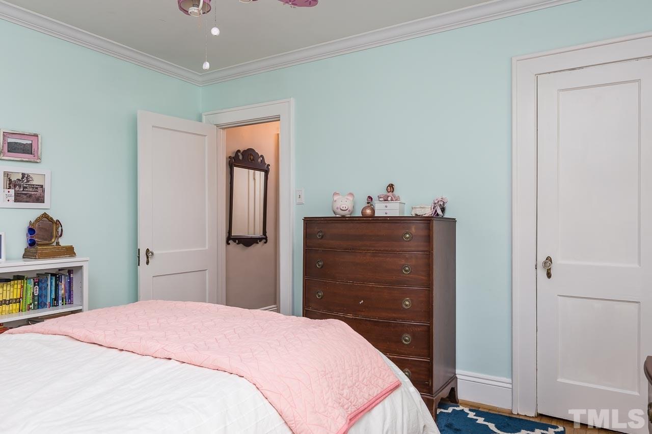 115 East Whitaker Mill Road Raleigh, NC 27608 - Photo 17 of 24 a bedroom with a bed and a dresser