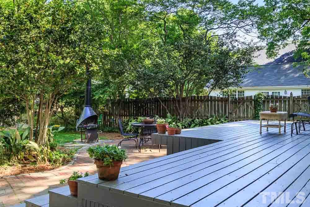 115 East Whitaker Mill Road Raleigh, NC 27608 - Photo 21 of 24 a view of backyard with deck and outdoor seating