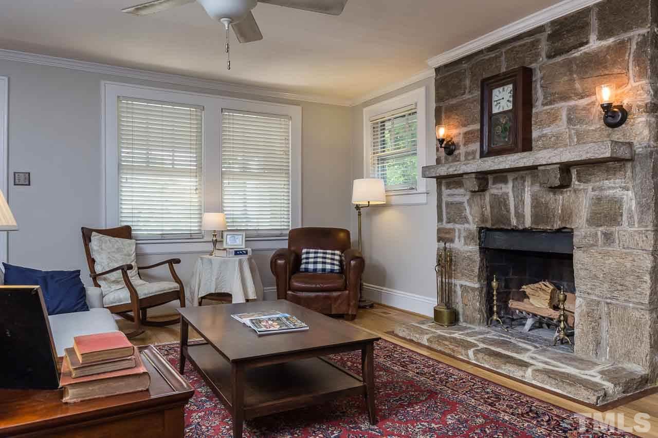 115 East Whitaker Mill Road Raleigh, NC 27608 - Photo 4 of 24 a living room with furniture and a fireplace