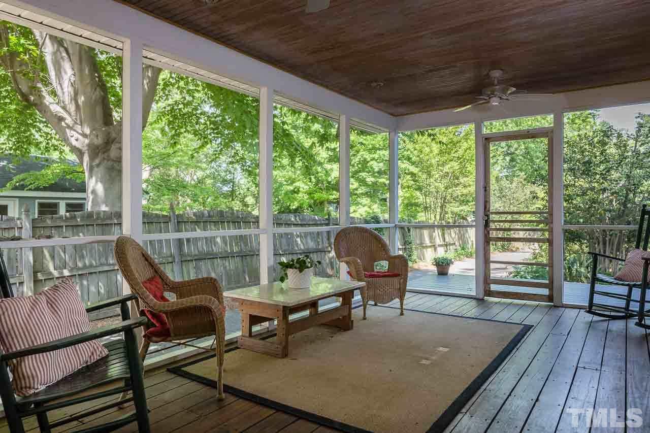 115 East Whitaker Mill Road Raleigh, NC 27608 - Photo 10 of 24 a balcony with wooden floor and outdoor seating