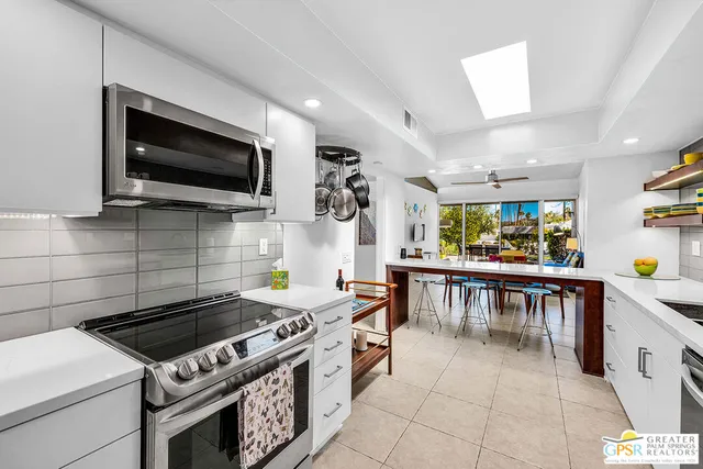 a kitchen with a stove and a microwave