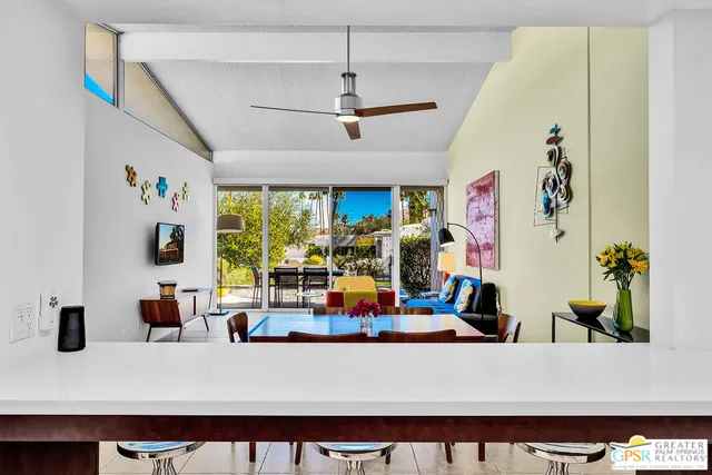 a living room with furniture and flat screen tv