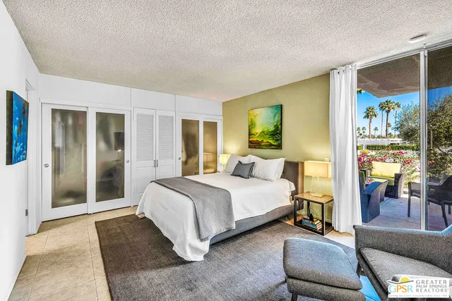 a bed room with a bed and a couch