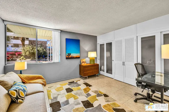 a bedroom with furniture and a window