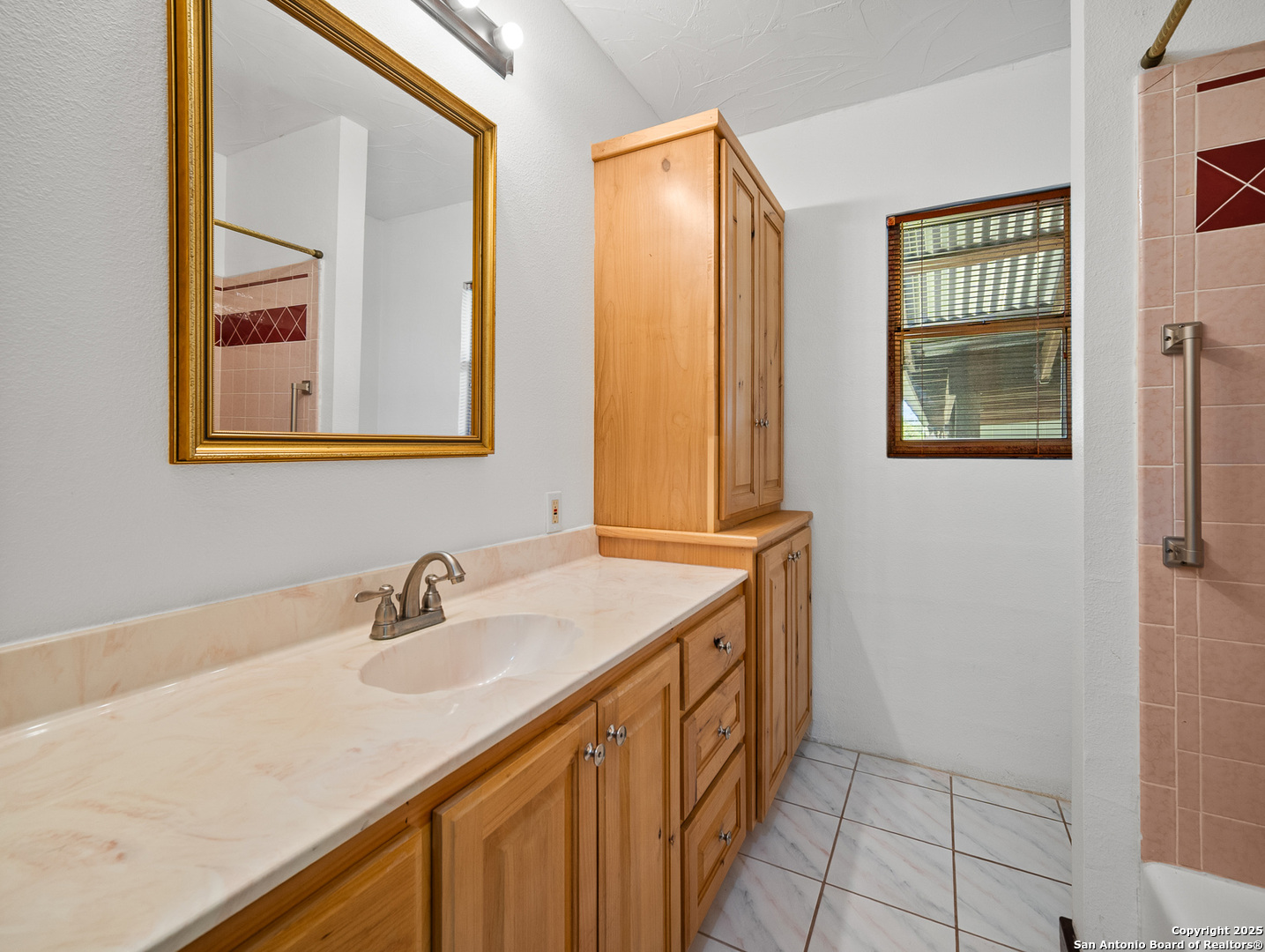 710 Chipman Lane Bandera, TX 78003 - Photo 12 of 42 a bathroom with a sink a vanity and a mirror