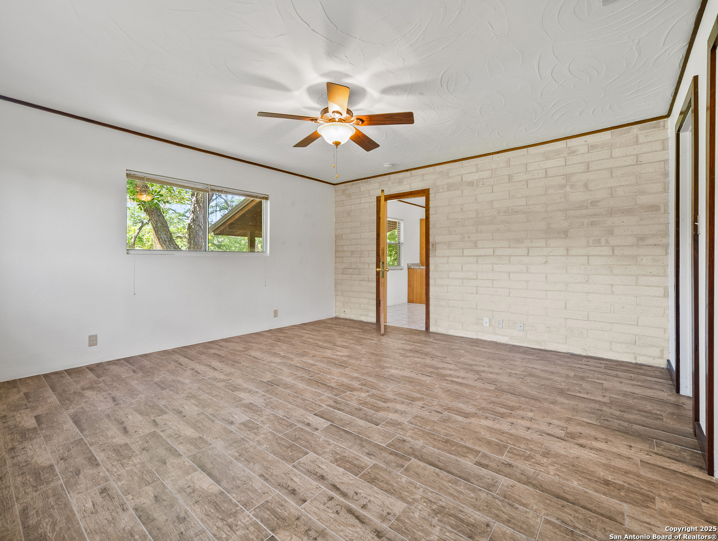 710 Chipman Lane Bandera, TX 78003 - Photo 16 of 42 a view of empty room with wooden floor