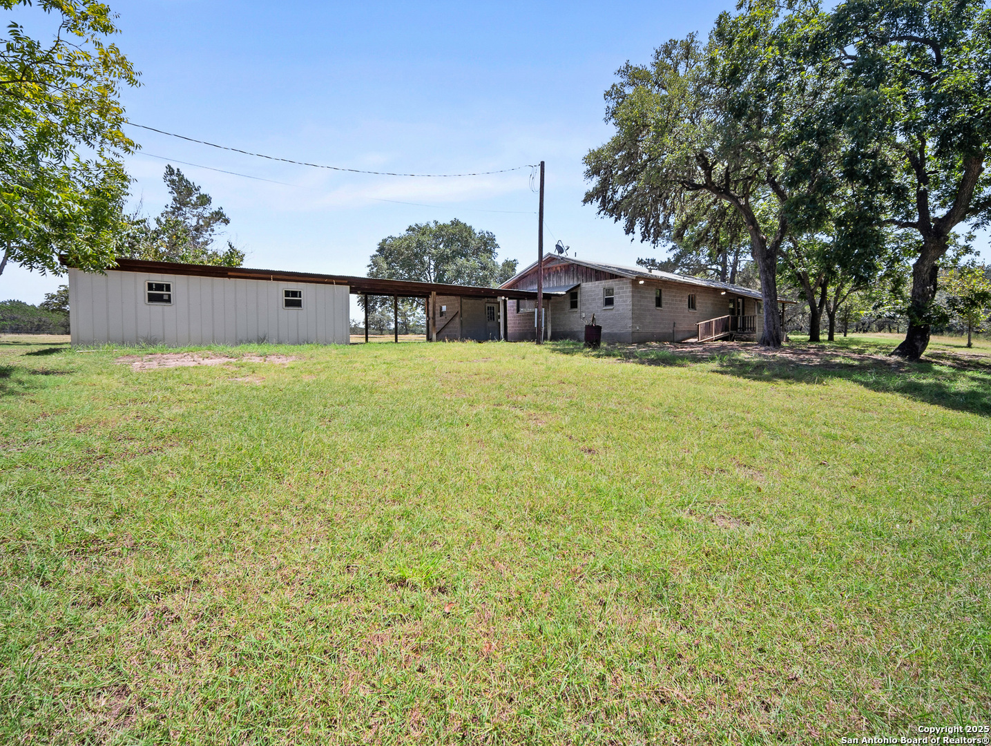 710 Chipman Lane Bandera, TX 78003 - Photo 23 of 42 front view of a house with a yard