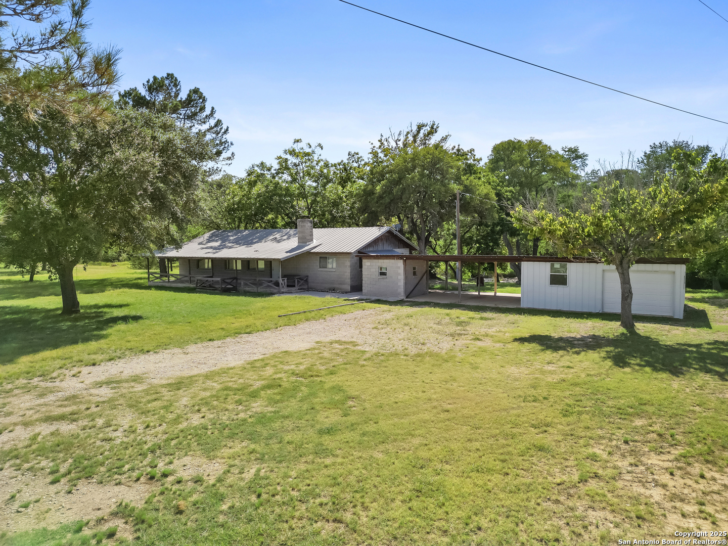 710 Chipman Lane Bandera, TX 78003 - Photo 24 of 42 a swimming pool with wooden fence