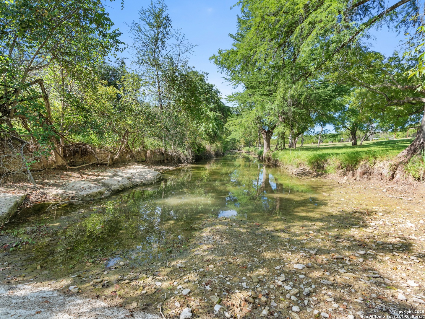 710 Chipman Lane Bandera, TX 78003 - Photo 28 of 42 a view of lake with green space