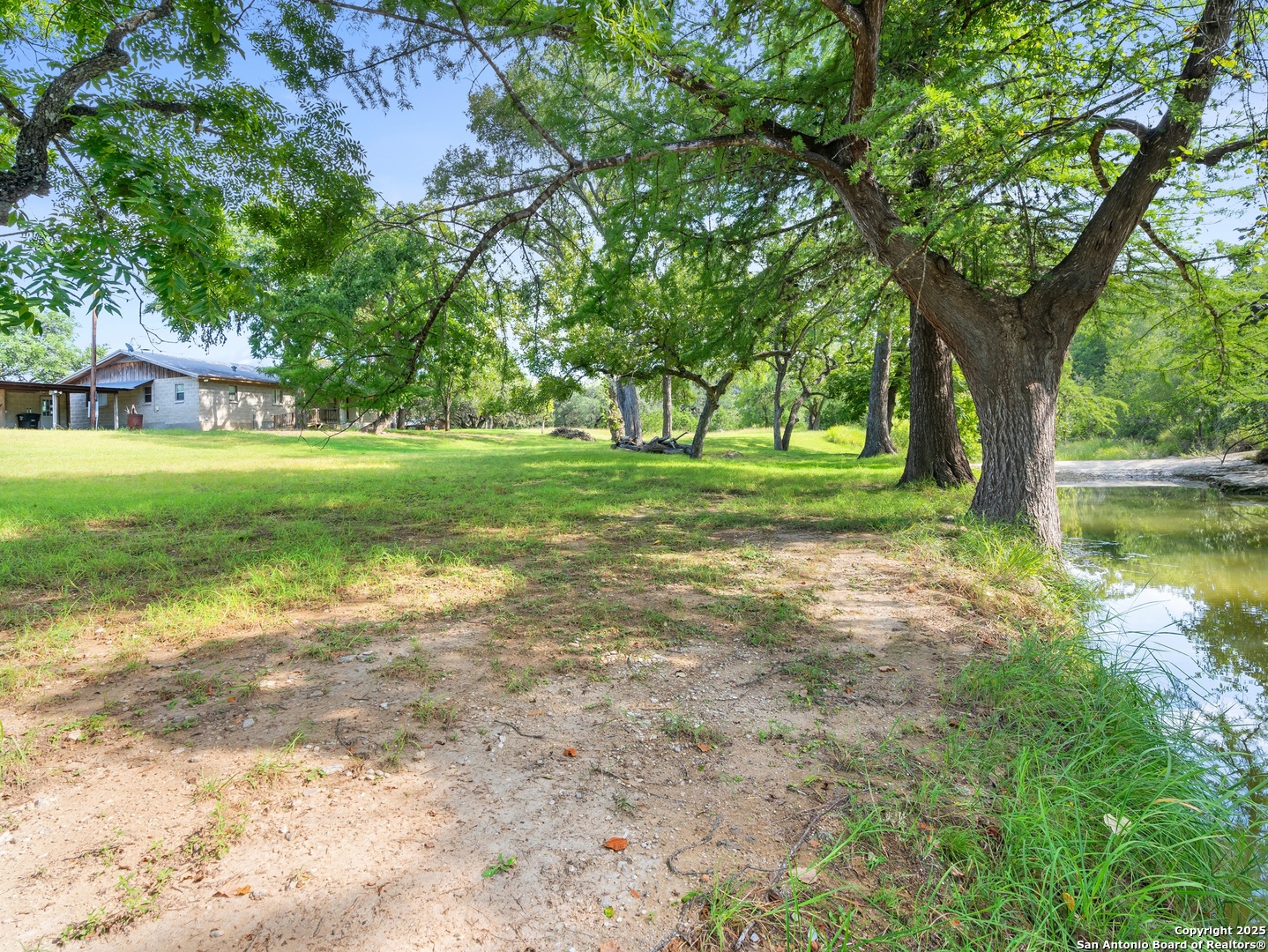 710 Chipman Lane Bandera, TX 78003 - Photo 29 of 42 a view of a yard with a tree