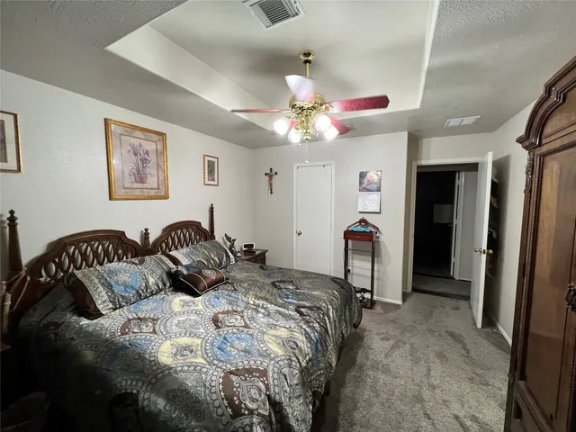 a bathroom with a sink mirror and shower