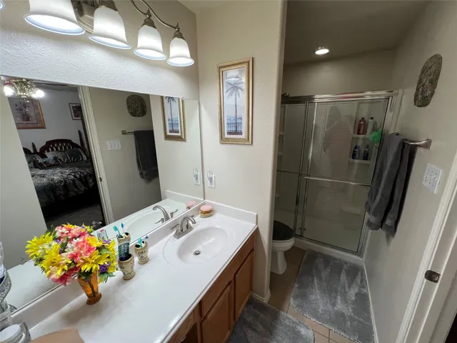 a bathroom with a shower and toilet