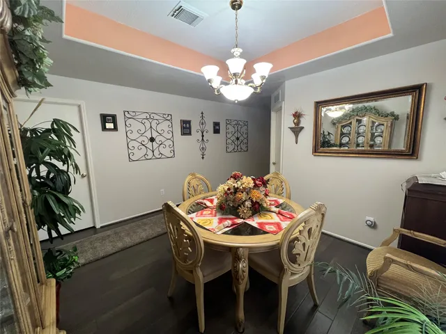 a kitchen with granite countertop a sink appliances and cabinets