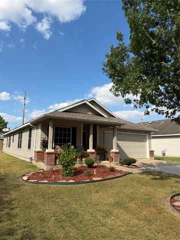 a front view of a house with swimming pool and porch with furniture