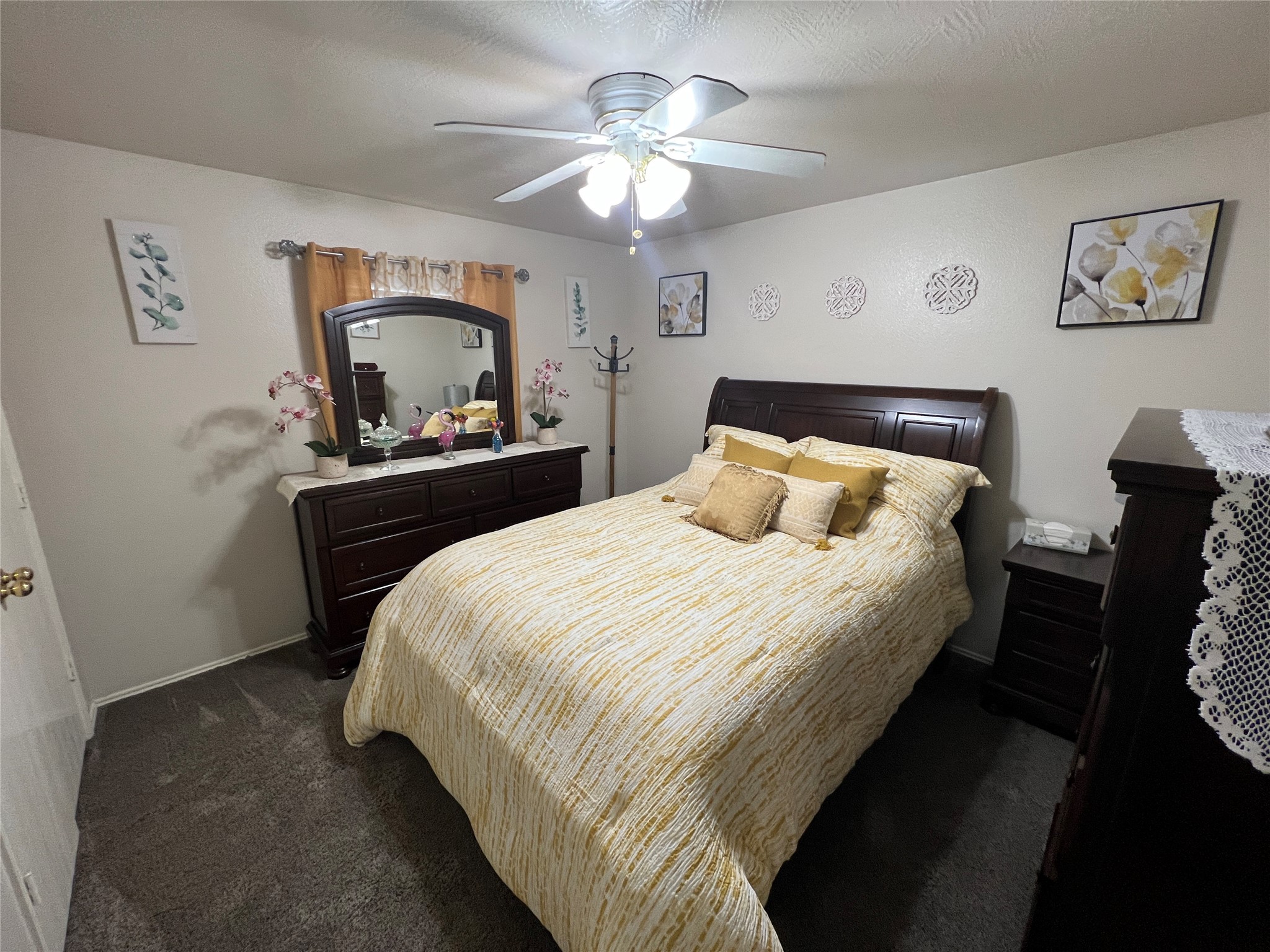 19306 Yaupon Ranch Drive Cypress, TX 77433 - Photo 27 of 29 a bedroom with a bed and a chandelier
