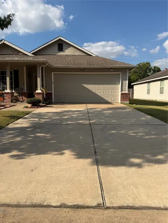 a front view of a house with a garage