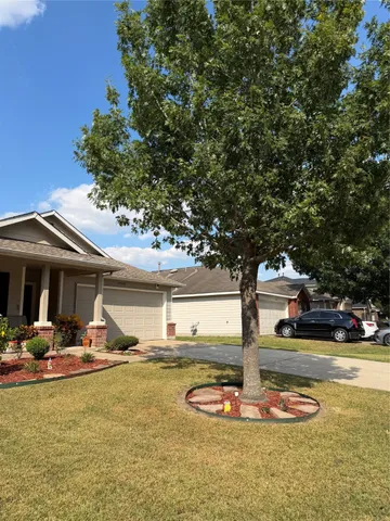 a front view of a house with swimming pool and dining table and chairs