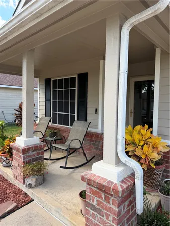 a outdoor space with patio the couches and a potted plant