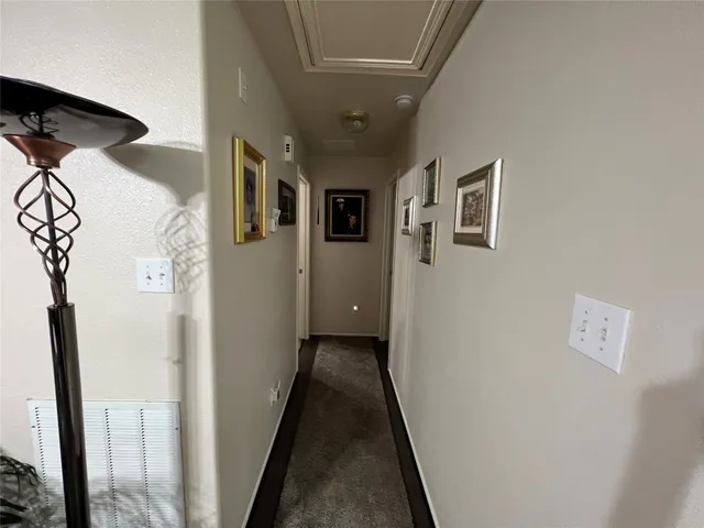 a bed room with a bed mirror and a window