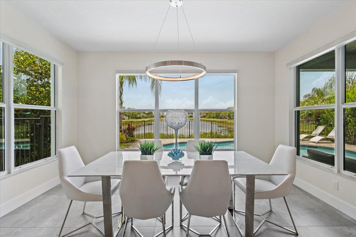 15377 Green River Court Delray Beach, FL 33446 - Photo 11 of 49 a view of a dining room with furniture window and outside view