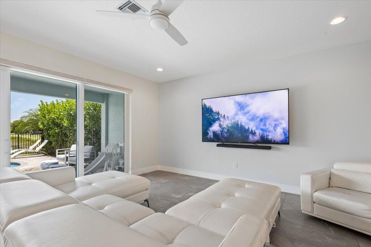 15377 Green River Court Delray Beach, FL 33446 - Photo 13 of 49 a bedroom with furniture and a large window