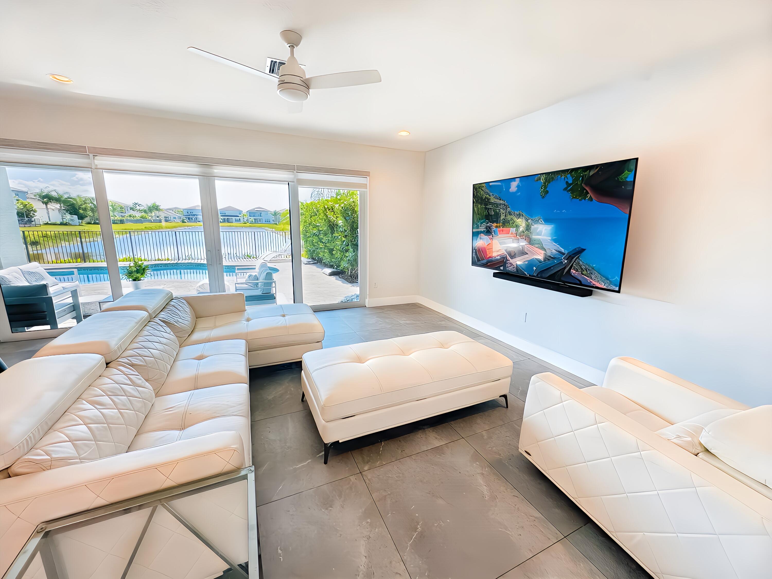 15377 Green River Court Delray Beach, FL 33446 - Photo 14 of 49 a living room with furniture and a flat screen tv