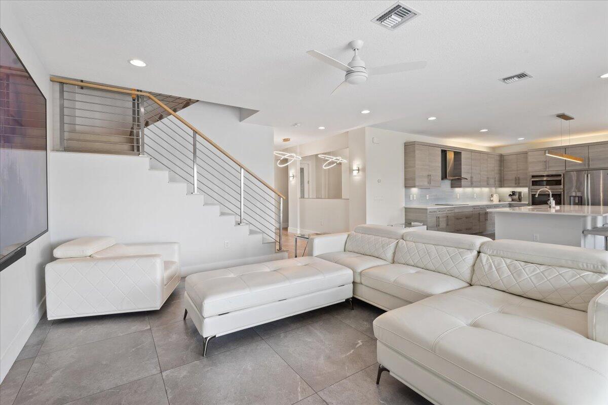 15377 Green River Court Delray Beach, FL 33446 - Photo 15 of 49 a living room with furniture and a view of kitchen