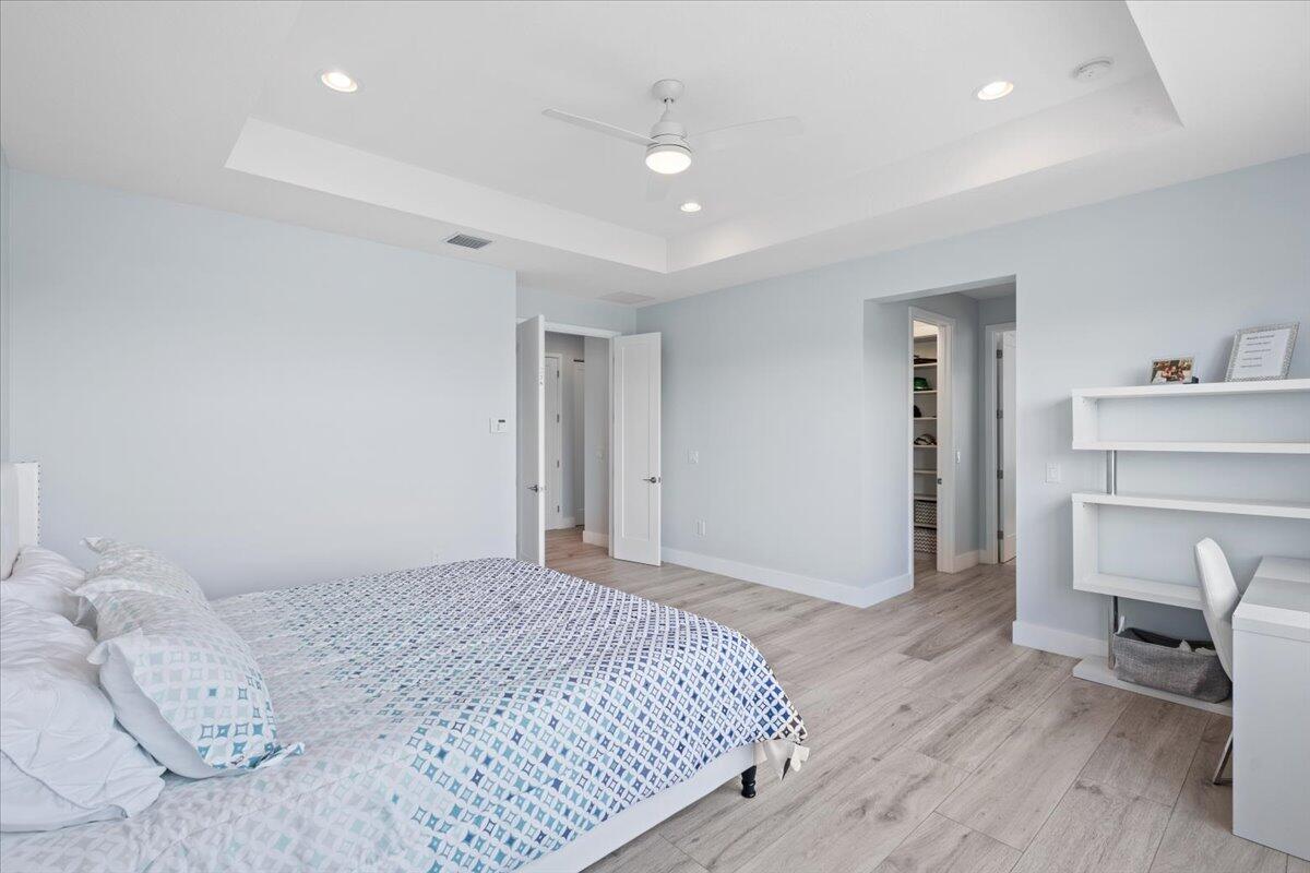 15377 Green River Court Delray Beach, FL 33446 - Photo 24 of 49 a bedroom with a bed and a fireplace