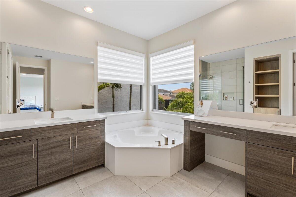 15377 Green River Court Delray Beach, FL 33446 - Photo 29 of 49 a bathroom with a tub sink and mirror