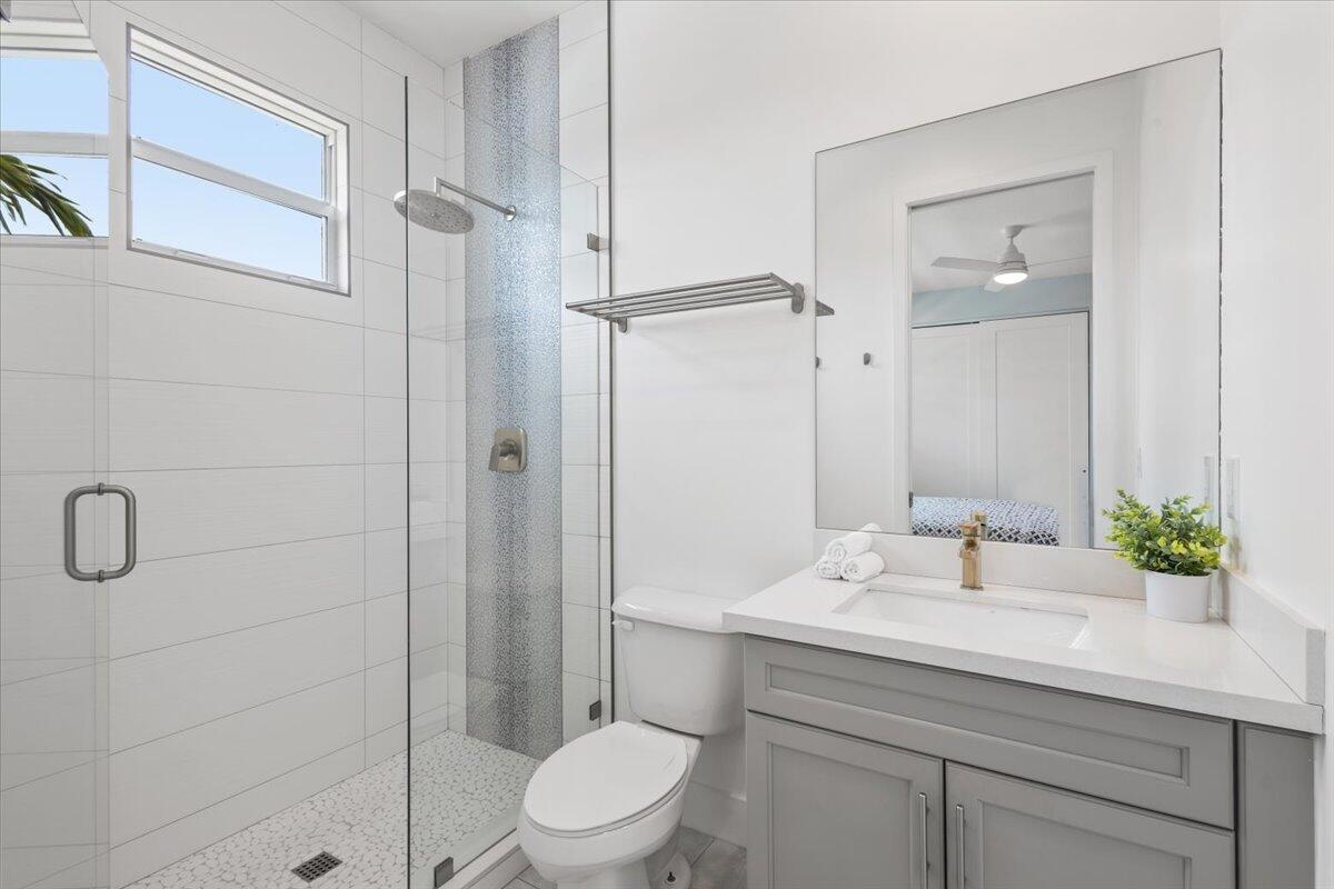 15377 Green River Court Delray Beach, FL 33446 - Photo 34 of 49 a bathroom with a sink a toilet and shower