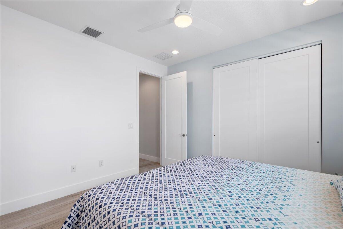 15377 Green River Court Delray Beach, FL 33446 - Photo 35 of 49 a big room with closet and wooden floor