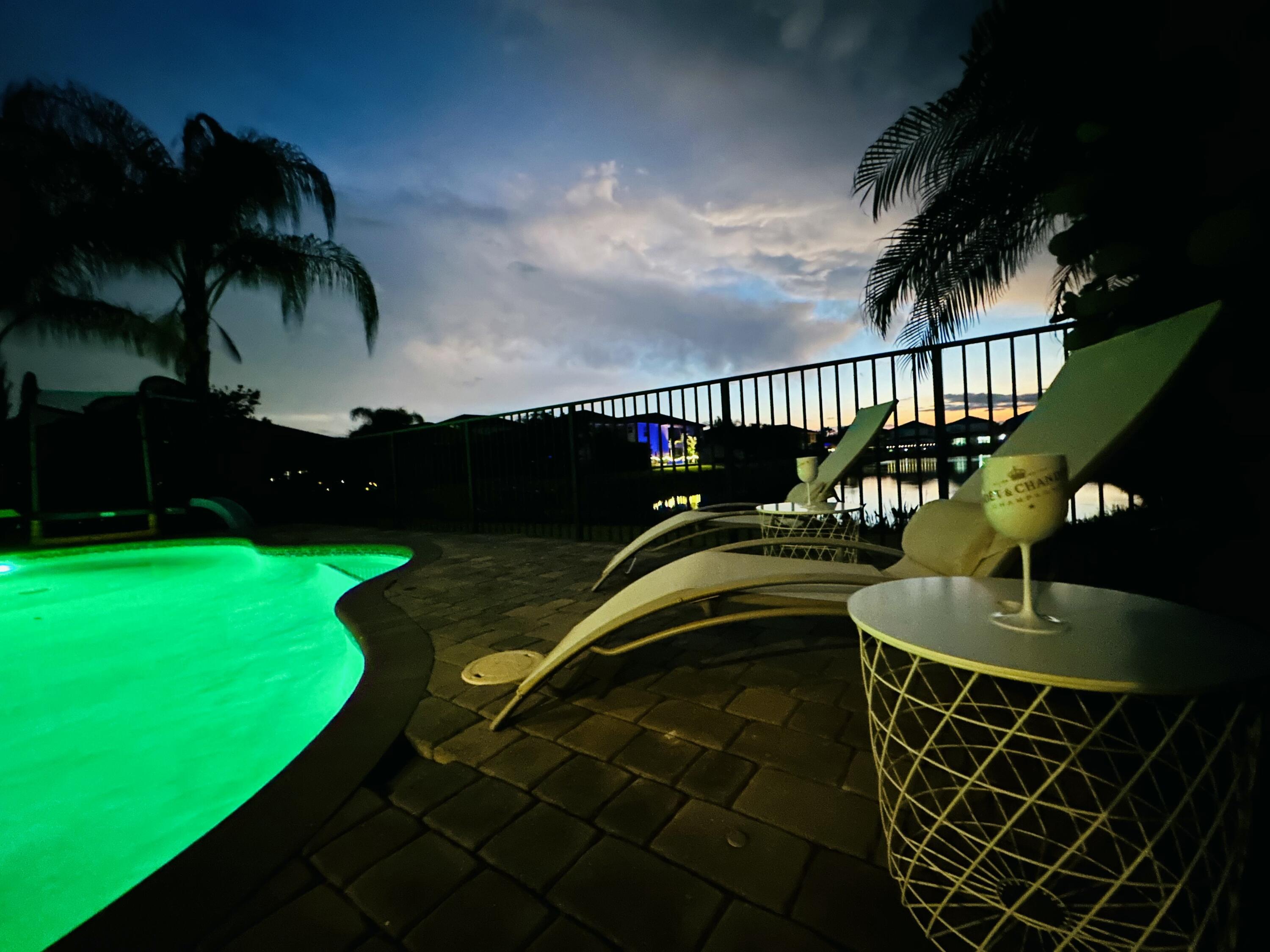 15377 Green River Court Delray Beach, FL 33446 - Photo 38 of 49 a picture of a table and chairs with wooden floor