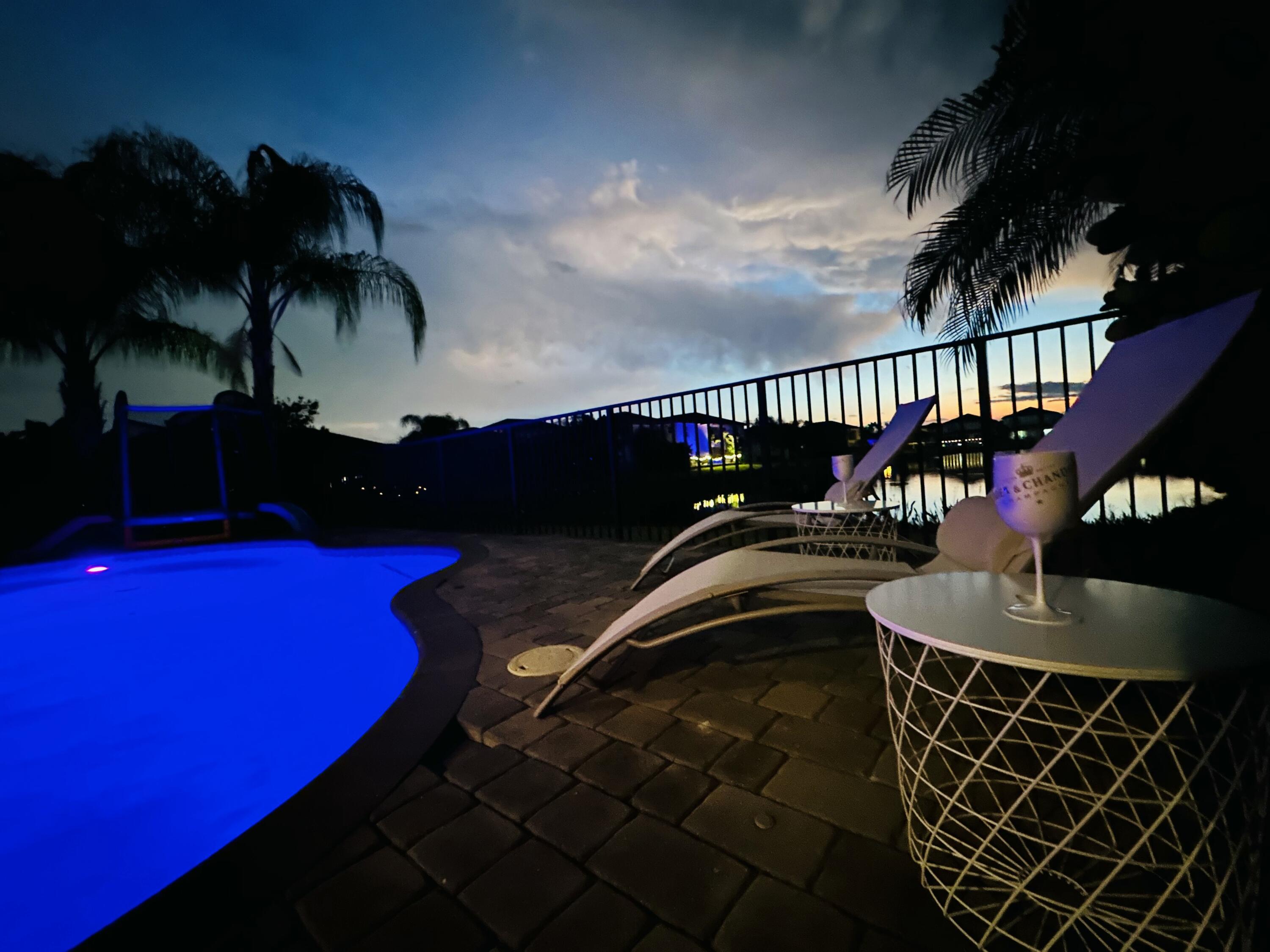 15377 Green River Court Delray Beach, FL 33446 - Photo 39 of 49 a front view of a house with a garden