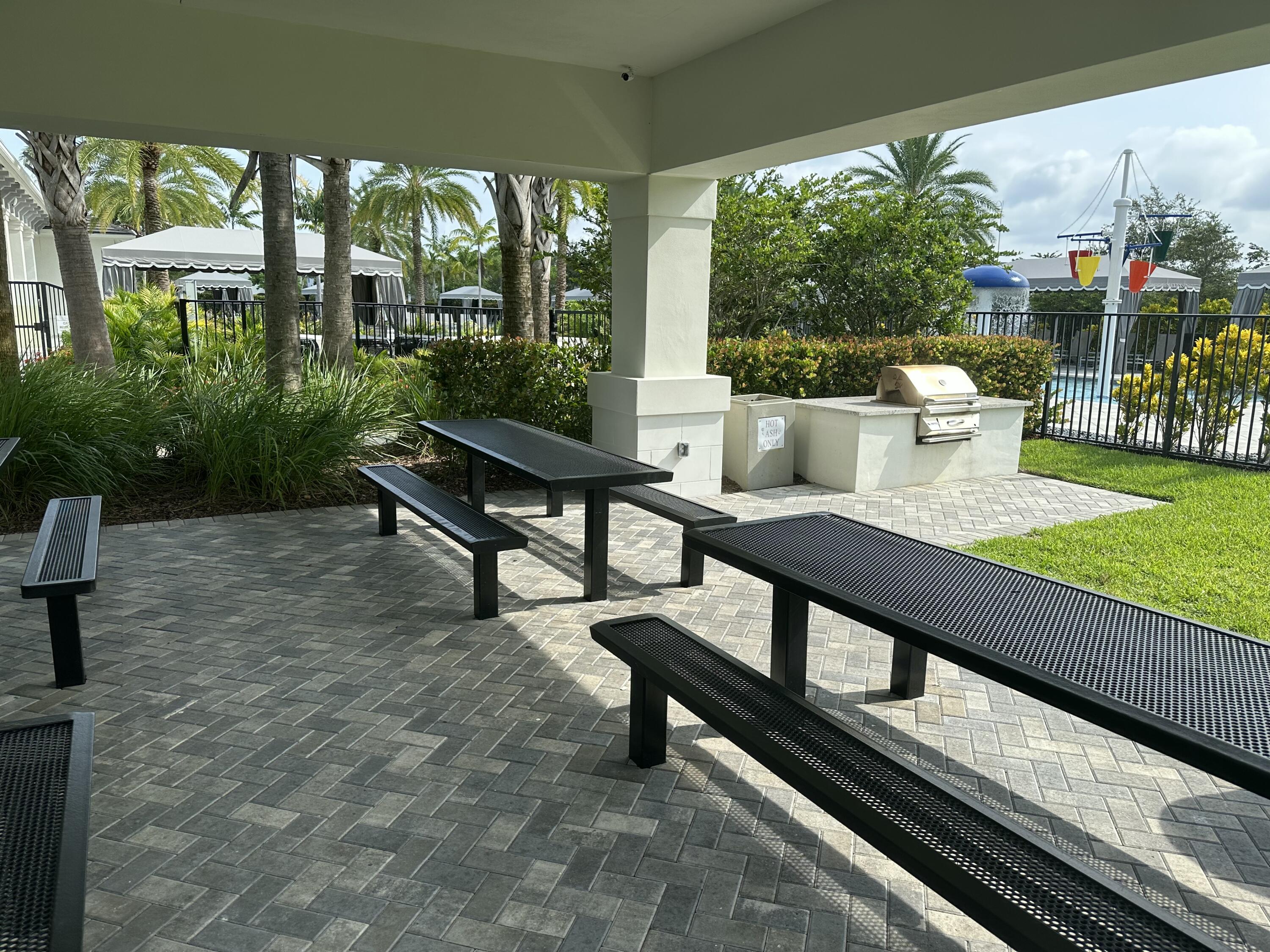15377 Green River Court Delray Beach, FL 33446 - Photo 43 of 49 a view of a patio with a table chairs and a backyard