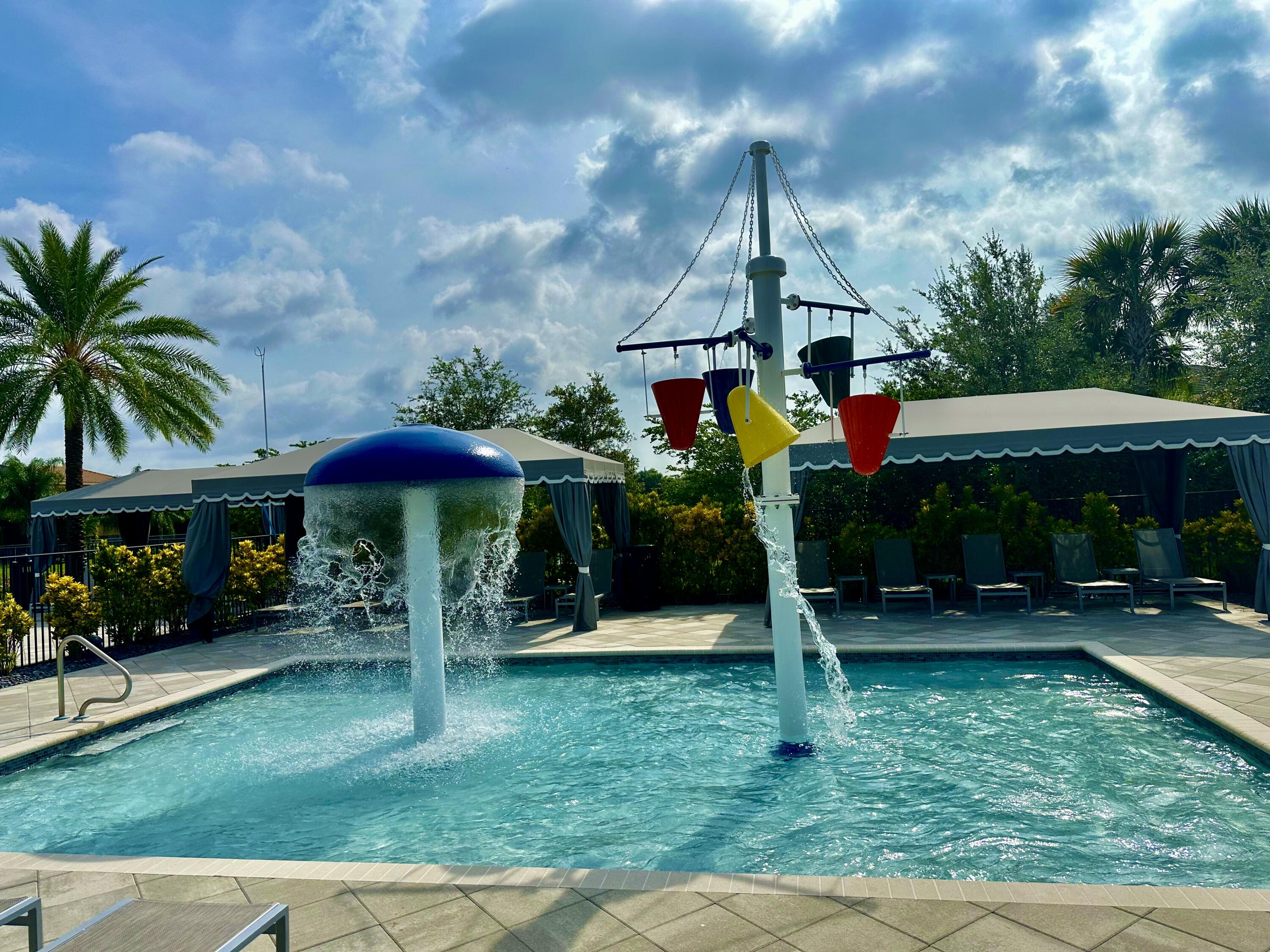 15377 Green River Court Delray Beach, FL 33446 - Photo 44 of 49 a front view of a house with garden