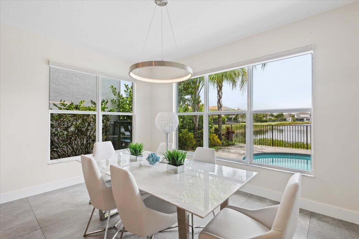 15377 Green River Court Delray Beach, FL 33446 - Photo 10 of 49 a view of a dining room with furniture window and outside view
