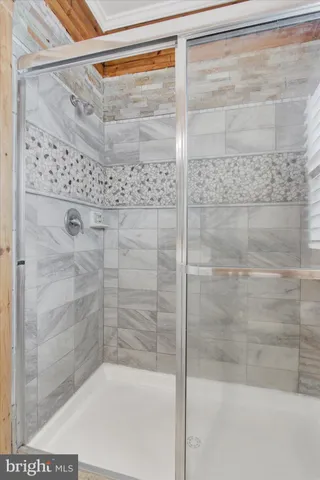 a bathroom with a toilet a sink and a window