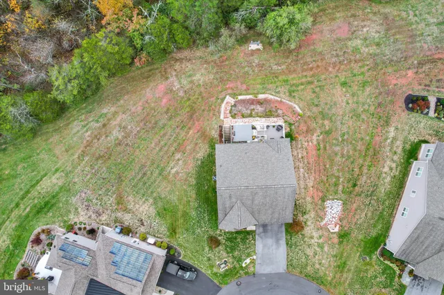 an aerial view of a house with outdoor space