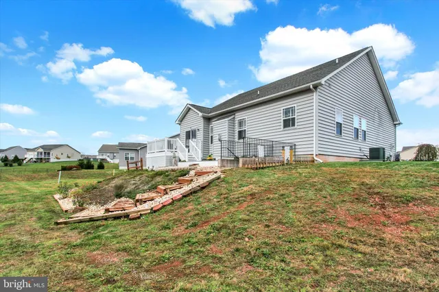 an aerial view of a house with outdoor space