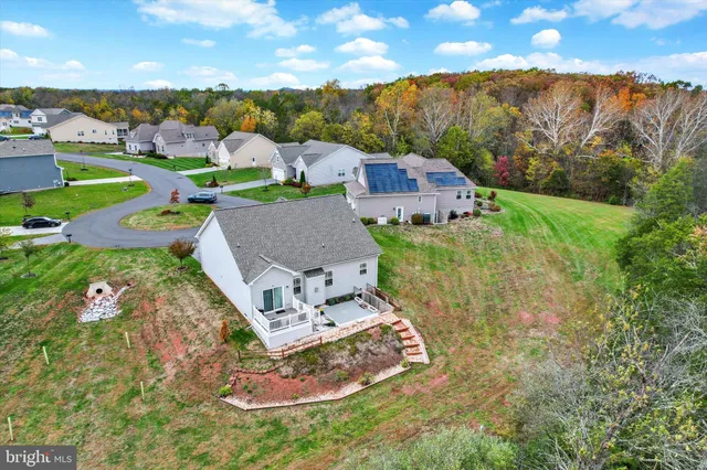 an aerial view of residential houses with outdoor space
