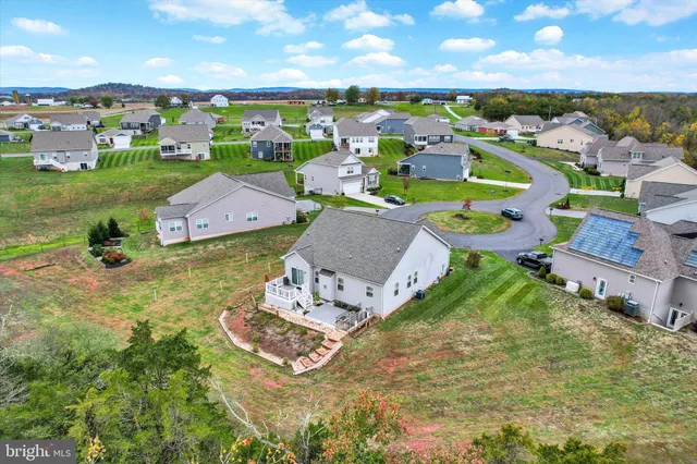 an aerial view of a house with a garden