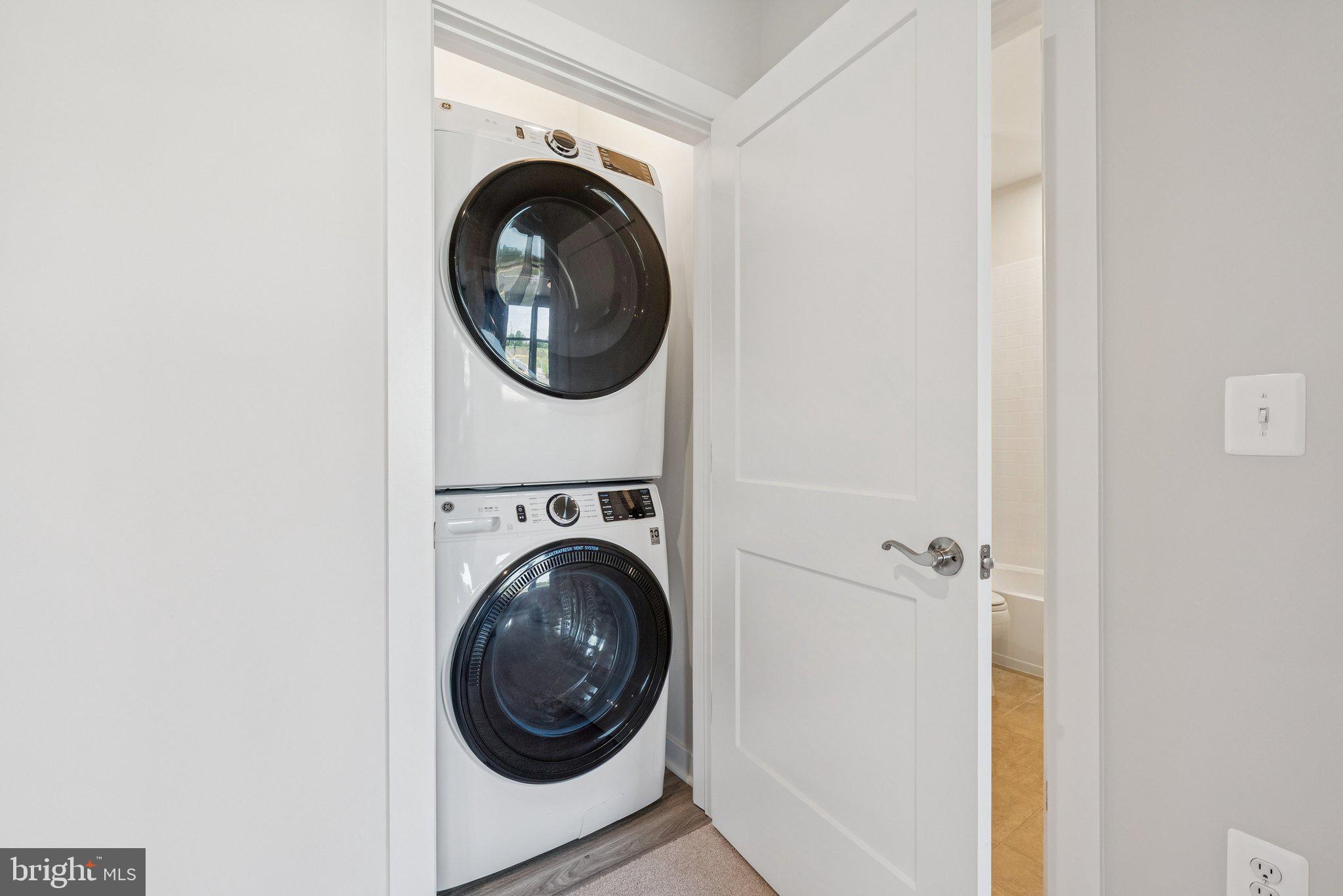 8702 Lovelace Street Manassas, VA 20110 - Photo 16 of 27 a close up view of a washer and dryer